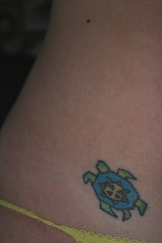 Little , blue robot  beetle hip tattoo