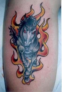 Angry horse in flames tattoo