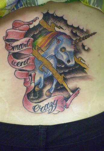 Blue unicorn in black storm tattoo