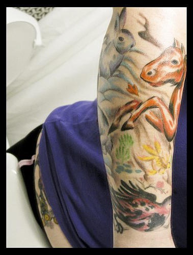Bunch of real animals sleeve tattoo