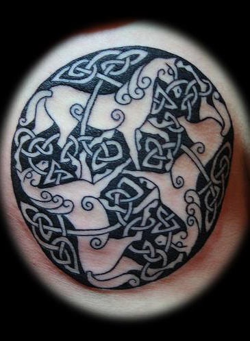 Celtic tracery with three horses tattoo