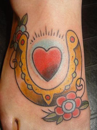 Golden horseshoe and heart classic tattoo