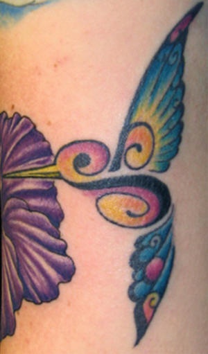 Musical hummingbird and flower tattoo