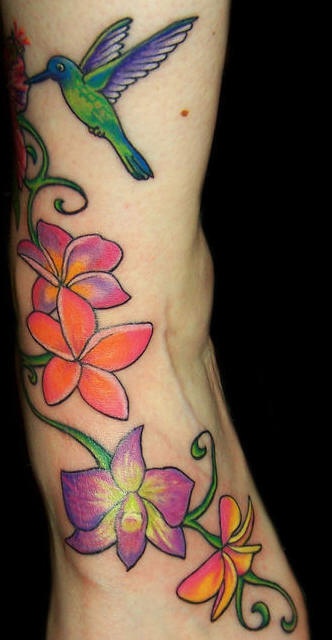 Hummingbird and purple flowers vine tattoo