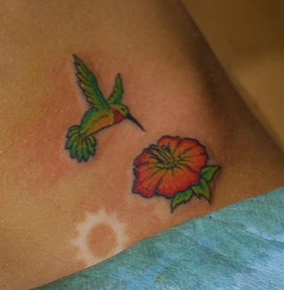 Tiny hummingbird and flower tattoo