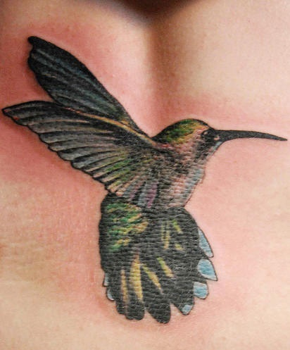 Green hummingbird flight tattoo