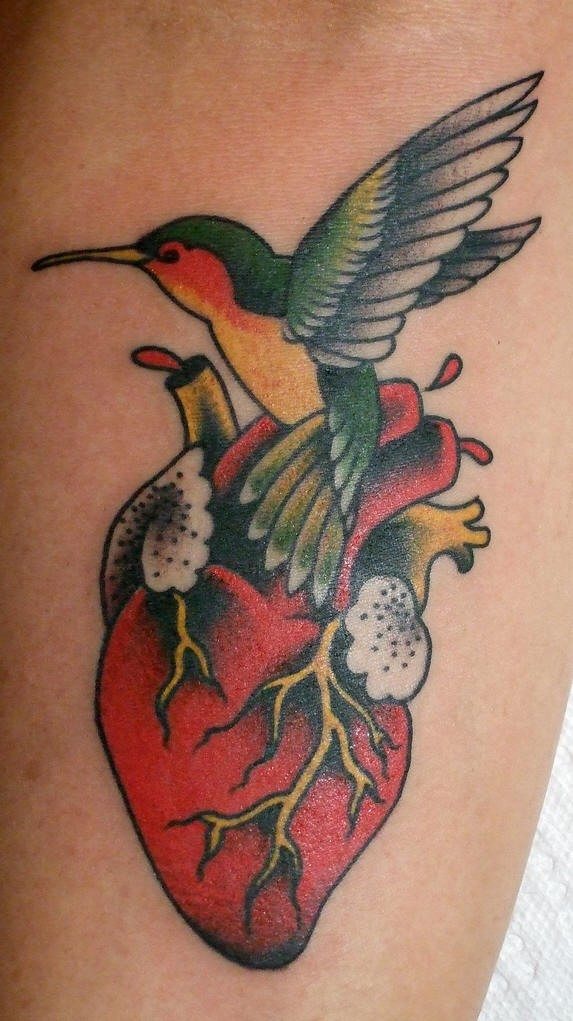 Real heart and hummingbird tattoo