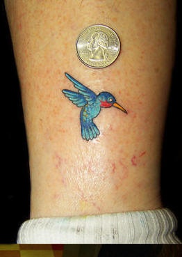 Tiny classic hummingbird tattoo