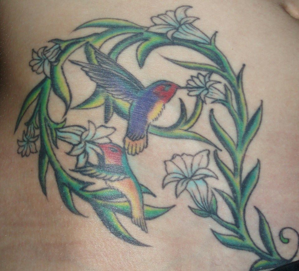 Hummingbirds in greens tattoo in colour