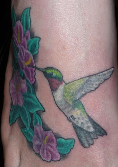 Realistic small hummingbird tattoo