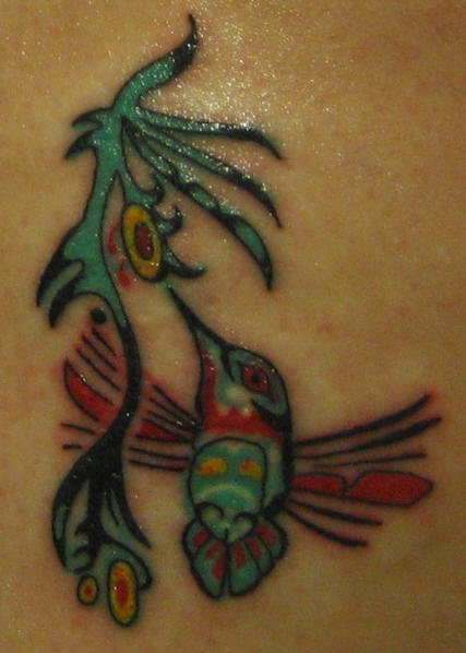 Tribal coloured hummingbird tattoo