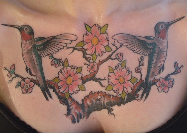 Symmetrical hummingbirds tattoo on chest