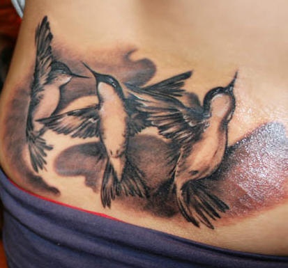 Three black hummingbirds tattoo