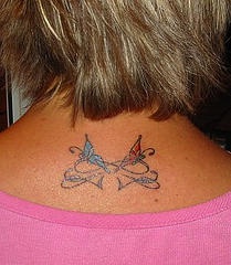 Lady butterfly bow on neck tattoo