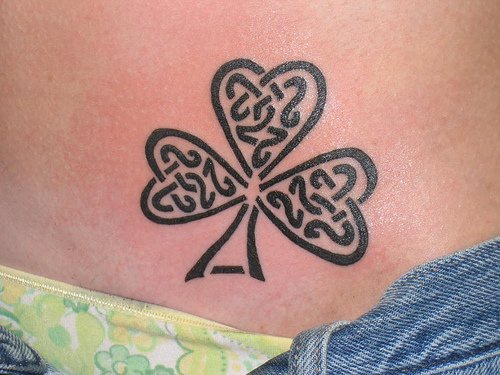 Tribal style clover tattoo