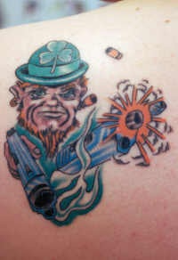 Irish leprechaun with guns coloured tattoo