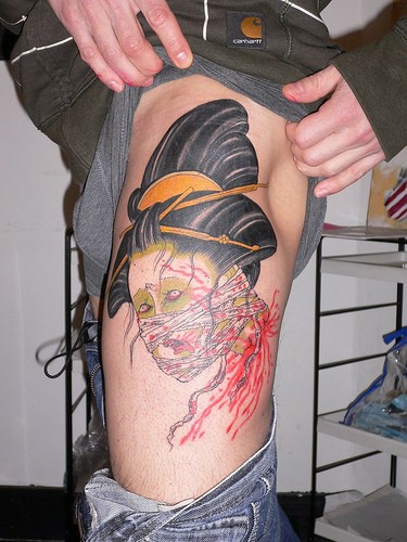 Dead geisha tattoo on hip