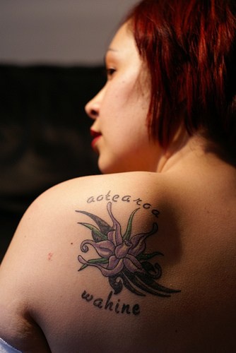 Pale purple orchid tattoo on shoulder