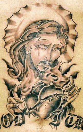 Jesus and flaming heart tattoo