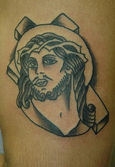 Minimalistic Jesus and cross tattoo