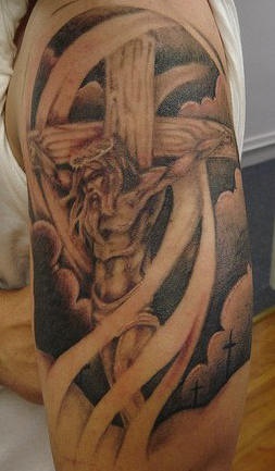 Jesus on cross in clouds tattoo