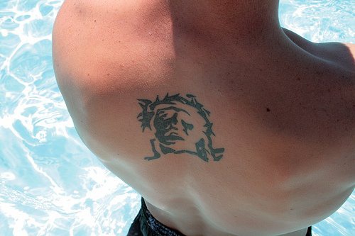 Christian tattoo on back