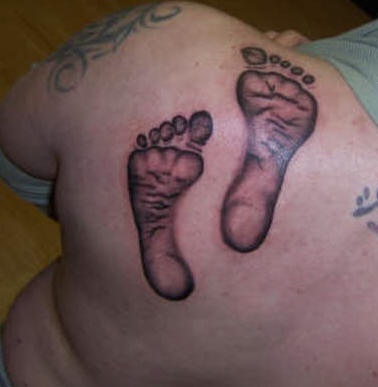 Kid footprints tattoo