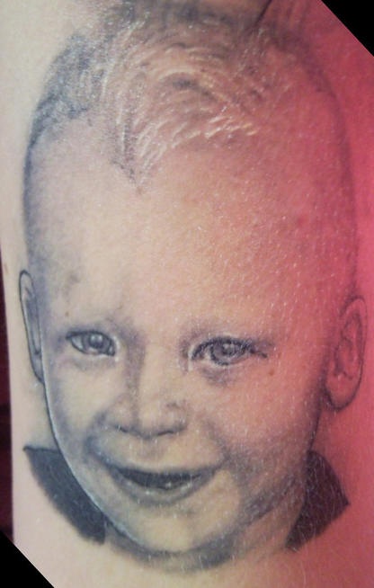 realistico viso del bambino  tatuaggio