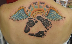 Footsteps and nimbus with wings tattoo