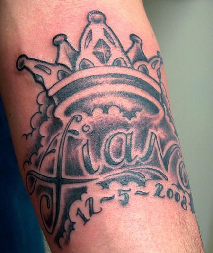 Crown in sky with name tattoo