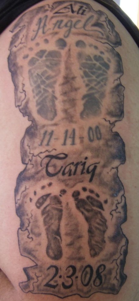 Children footsteps tattoo with date of birth