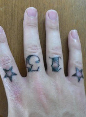Knuckle tattoo, 13 between stars styled