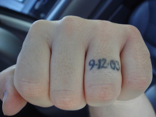 Knuckle tattoo, little size date on one finger