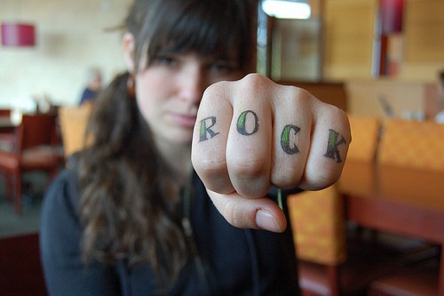 Knuckle tattoo, rock, green styled word