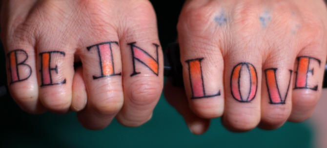 Knuckle tattoo, be in love, red shiny letters