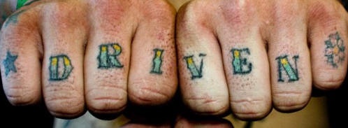 Knuckle tattoo, driven, decorated with star, flower