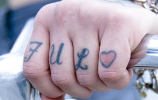 Knuckle tattoo, full love,composing of  word and image