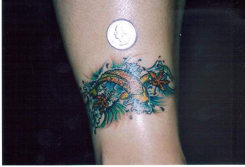 Small koi fish armband tattoo