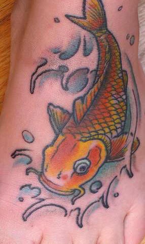 Golden koi fish tattoo on foot