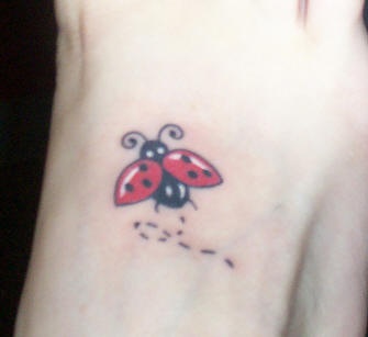 Ladybug flight tattoo