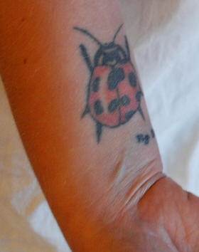Big ladybug tattoo on wrist