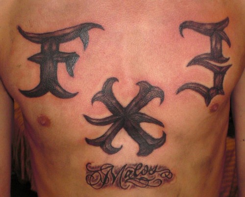 Large signs  chest tattoo