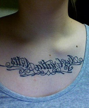 Latin pattern text tattoo on chest