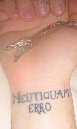 Neutiquam erro wrist tattoo