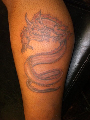 Leg sleeve tattoo, red monster dragon, awful  snake