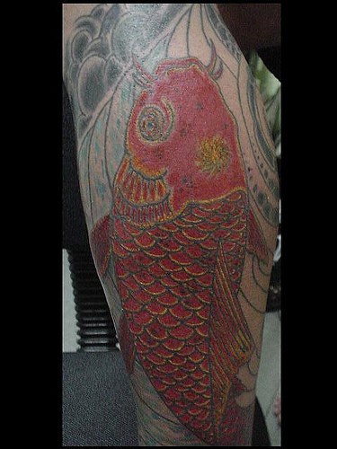 Leg tattoo, big red fat fish, styled catfish