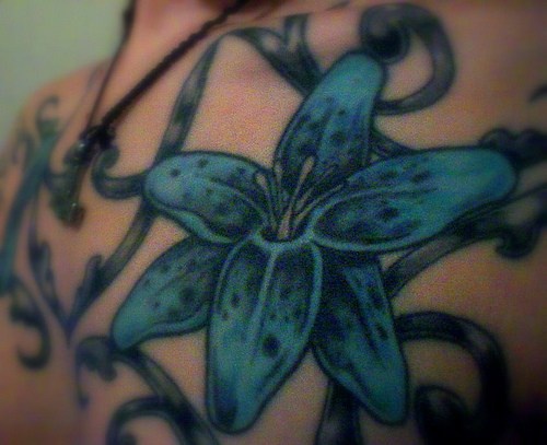 Blue lush lily in tracery tattoo