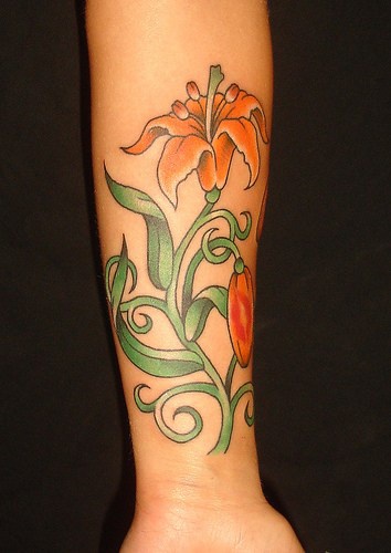 Yellow lily flower blossom tattoo