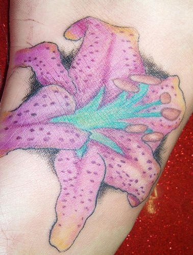 Realistic dotted pink lily tattoo