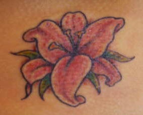 Small pink lily tattoo